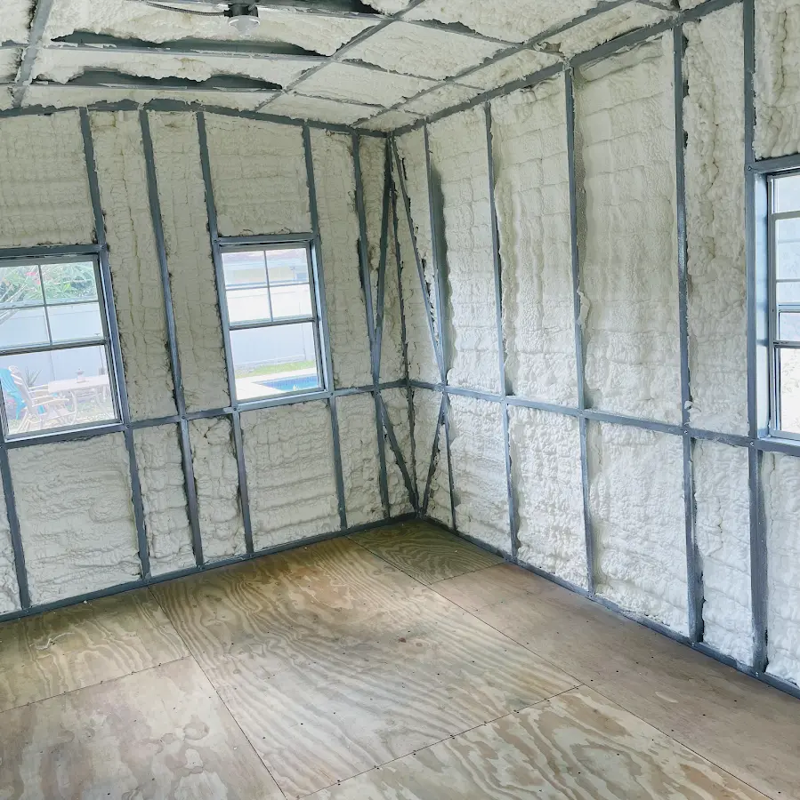 Closed-cell spray foam insulation applied to wall cavities in a residential project in Eaton